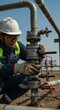 © Margarita Ratatosk - Oil and gas worker inspecting valve on pipeline. Man engineer checking equipment. Petroleum industry maintenance and operation.