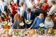 © Rawpixel.com - Lively gathering with diverse guests.