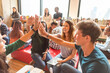 © Rawpixel.com - Diverse group celebrating teamwork success.
