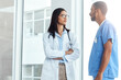 © peopleimages.com - Teamwork, talking and doctor with nurse in hospital for patient results, treatment plan and surgery schedule. Healthcare, collaboration and man with woman for medical service, wellness and discussion