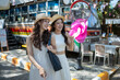 © apichat - Happy asian women friends traveling city street market
