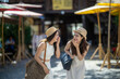 © apichat - Happy young women friends laughing enjoying travel vacation