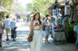 © apichat - Young woman enjoying market street exploring vacation travel