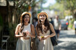 © apichat - Young asian women friends traveling enjoying summer vacation