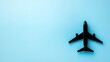 © Ivy - aerospace. An airplane silhouette on a blue background, presented in an overhead flat lay composition. mobility guides, transit brochures, designed for transport & logistics marketing.