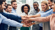 © Backround art - Diverse Business Team Members Showing Unity Through Hand Stacking Gesture in Modern Office