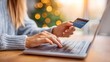 © NovaVision - Woman shopping online using a credit card for a secure transaction on her laptop.