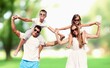 © BillionPhotos.com - A happy family walks in park at vacation time