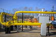 © juraj - Yellow pipelines and valves moving natural gas inside an industrial energy station