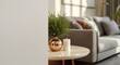© AkuAku - Copper vase holding synthetic greenery and white candle on cream table in a stylish apartment interior