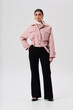 © Streetstylephoto - A girl model in stylish clothes poses in a photo studio.