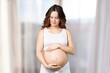 © BillionPhotos.com - Happy pregnant woman touching her belly