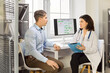 © Studio Romantic - Doctor and patient man discuss diagnosis at clinic. The physician holds a clipboard, listens to concerns, and explains options in a bright office. Clear concept of medical consultation.