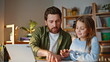 © stockbusters - Happy father teaching girl making homework browsing lesson tablet closeup.