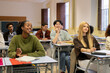 © Ladanifer - Diverse students listening intently, learning, and participating in high school