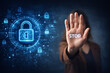 © KRNO - Person raising hand with stop sign gesture against digital cyber security interface symbolizing protection privacy and blocking cyber threats