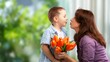 © BillionPhotos.com - Happy women's day. Child congratulating mom with flowers.