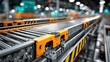 © Alfanachmad - Industrial conveyor belt system in a modern factory setting with yellow safety accents