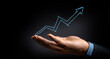 © Wendy - Businessman holding percentage graph symbol and up arrow. Concept of interest rate and tax calculation. Investment growth and profit. Dividend and long term investment to beat inflation
