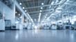 © sam richter - Bright spacious modern factory floor stretches into soft bokeh background lighting.