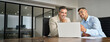 © insta_photos - Busy smiling business men entrepreneurs talking using laptop, business team of two executive managers working on computer in office managing data at meeting. Financial advisory investment consulting.