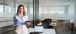 © insta_photos - Smiling mature business woman manager executive, happy middle aged businesswoman entrepreneur, 40 year old professional hr holding digital tablet looking at camera standing in office at work. Portrait