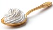 © Gulnaz - Golden spoon holds fluffy whipped cream