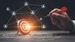 © Artfinity - Hand throwing dart at target with networking map. Business strategy and audience targeting concept. Professional person hitting center of goal for marketing success