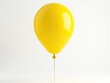 © Alena - A bright yellow balloon floating in the air attached to a wooden stick