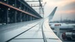 © K - aerospace. Close-up of an aircraft wing with a softly blurred industrial environment in the background. mobility guides, transit brochures, designed for transport & logistics marketing.