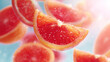 © Igor - Sliced Ruby Red Grapefruit with Water Droplets