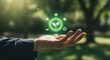 © MstZulakha - Hand holding glowing green circle with eco icons image