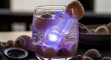 Refreshing cocktail in glass with ice and shell decorations closeup