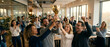 © udin - Excited business team celebrating success with a golden trophy in office.