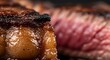 © tesla - Juicy Grilled Steak Close-up: Perfectly Cooked Meat with Charred Edges and Pink Interior