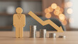© Wasif - Employee model, centered with a downward-pointing coin stack. This symbolizes the global economic downturn and the resulting need for organizational downsizing, wage cuts or employee layoffs. Global