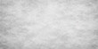© LumenCraft - A blank vintage white marble surface features a light gray textured pattern and a rough grunge wall backdrop for an old paper material design