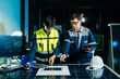 © Nuttapong punna - Engineers designing renewable energy project using wind turbine model and solar panels while reviewing digital blueprint. Concept of clean power, sustainability
