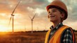 © Larisa AI - A cheerful young boy in an orange safety helmet smiles while standing in a field of wind turbines at sunset, symbolizing hope and a sustainable future in energy.
