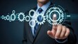 © The Galaxy  - Businessman in suit interacting with holographic digital gears representing technological process flow and system automation