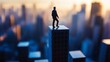 © Harry - A silhouette of a man standing on top of a skyscraper in a city during sunset