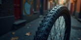 Close up of bicycle wheel with intricate tire tread patterns, gear, cycle parts