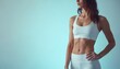 © miss irine - Fit woman in white activewear displays toned abs, physique. Stands confidently in studio setting against plain blue background, exuding health, wellness. Pose suggests strength, dedication to healthy