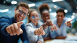 © Kateryna - Wide bright close up of a group of young business people from the waist down multiple hands pointing outward toward the camera in a unified gesture from a meeting table bright