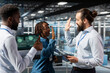 © DC Studio - Diverse pleased staff sharing a high five to enjoy their accomplishment on server farm industrial platform, cheering to their professional collaboration. Happy successful engineering team.