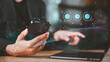 © chaylek - Cloud engineer managing secure data transfer on smartphone and laptop, integrating cloud computing network, cybersecurity framework, AI automation and digital transformation strategy