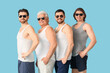 © Pixel-Shot - Group of men on blue background. Body positive concept