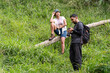 © Ibenk.88 - Asian Indonesian Hiking Couple Reviewing Camera Photo on Forest Trail