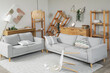 © Pixel-Shot - Interior of messy living room with overturned furniture after earthquake