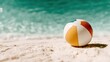 © Pinklife - A vibrant beach ball rests on a sandy shoreline, with gentle waves lapping in the background, perfectly capturing the essence of summer fun and relaxation by the beach.
